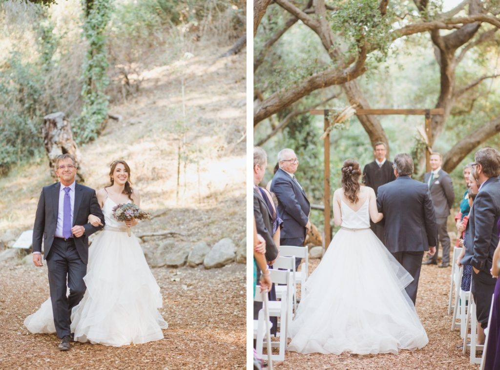 bride walking down the aisle in oak trees