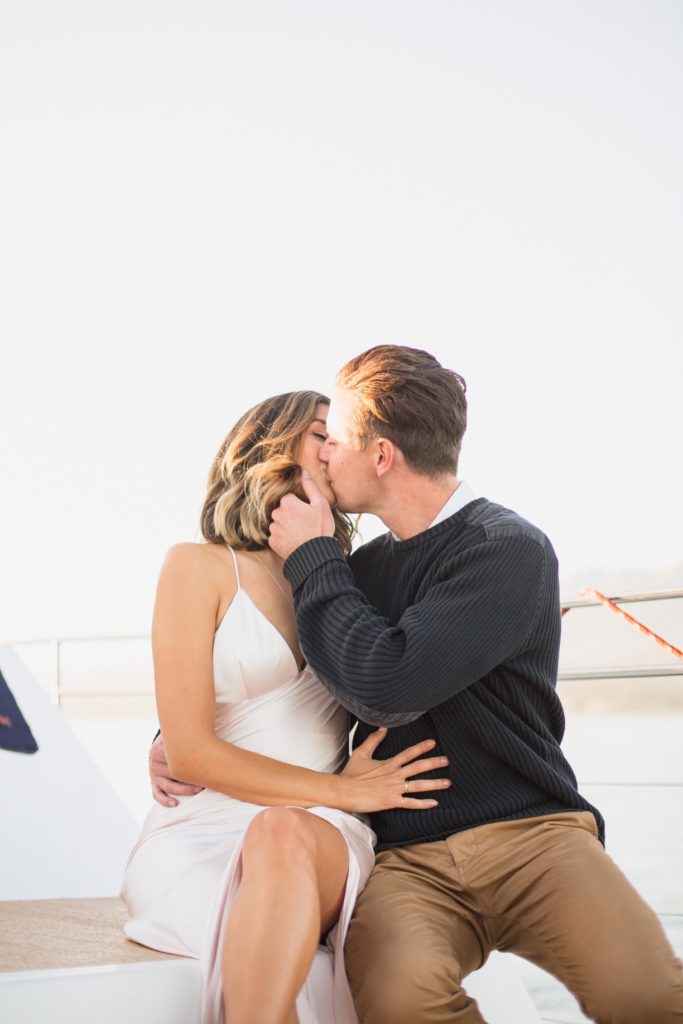 couple kissing on boat