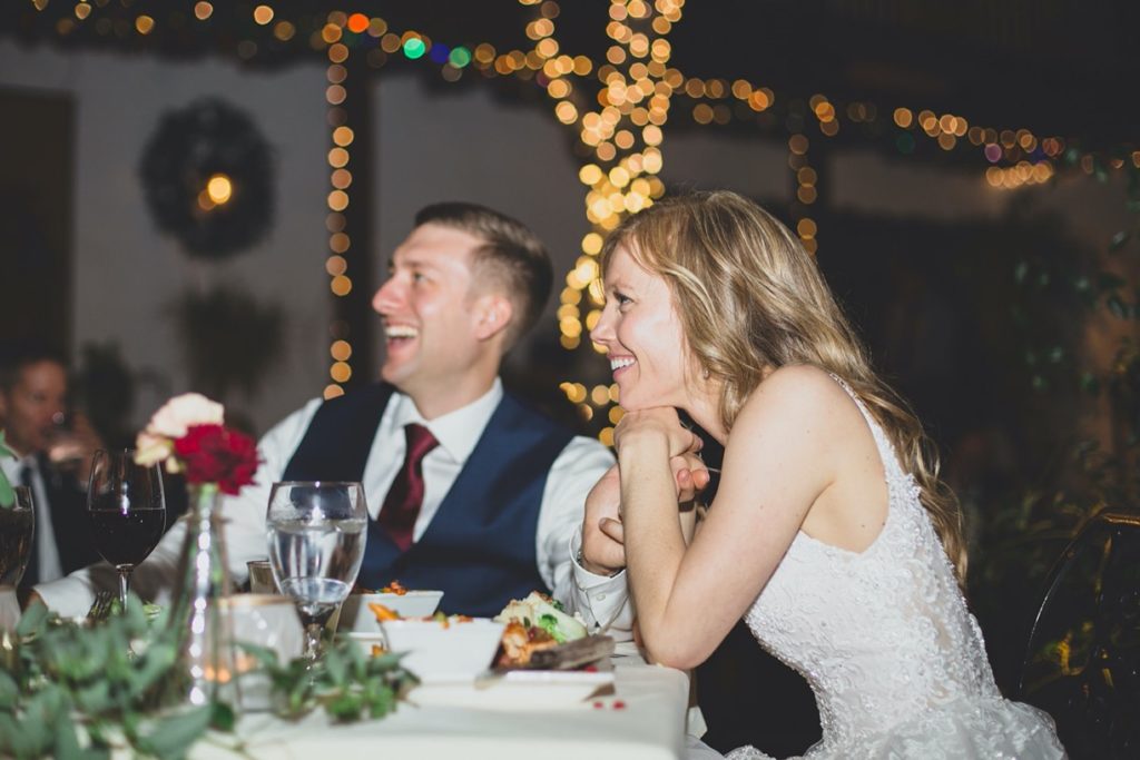 bride and groom laughing speeches
