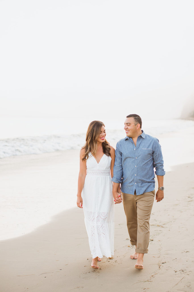 walking on the beach engagement photos