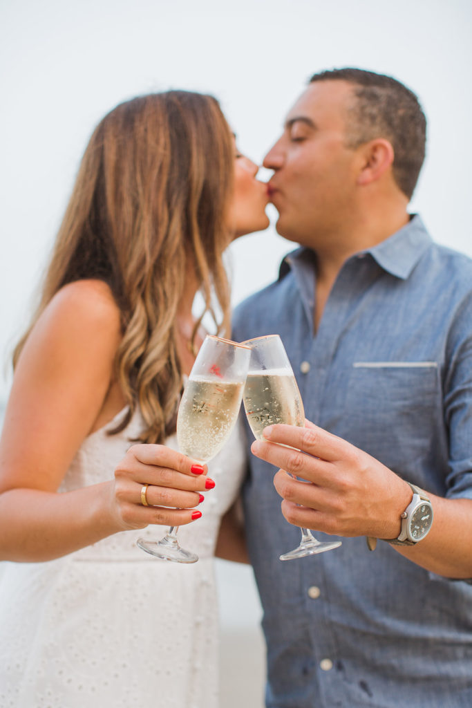 popping champagne engagement photos