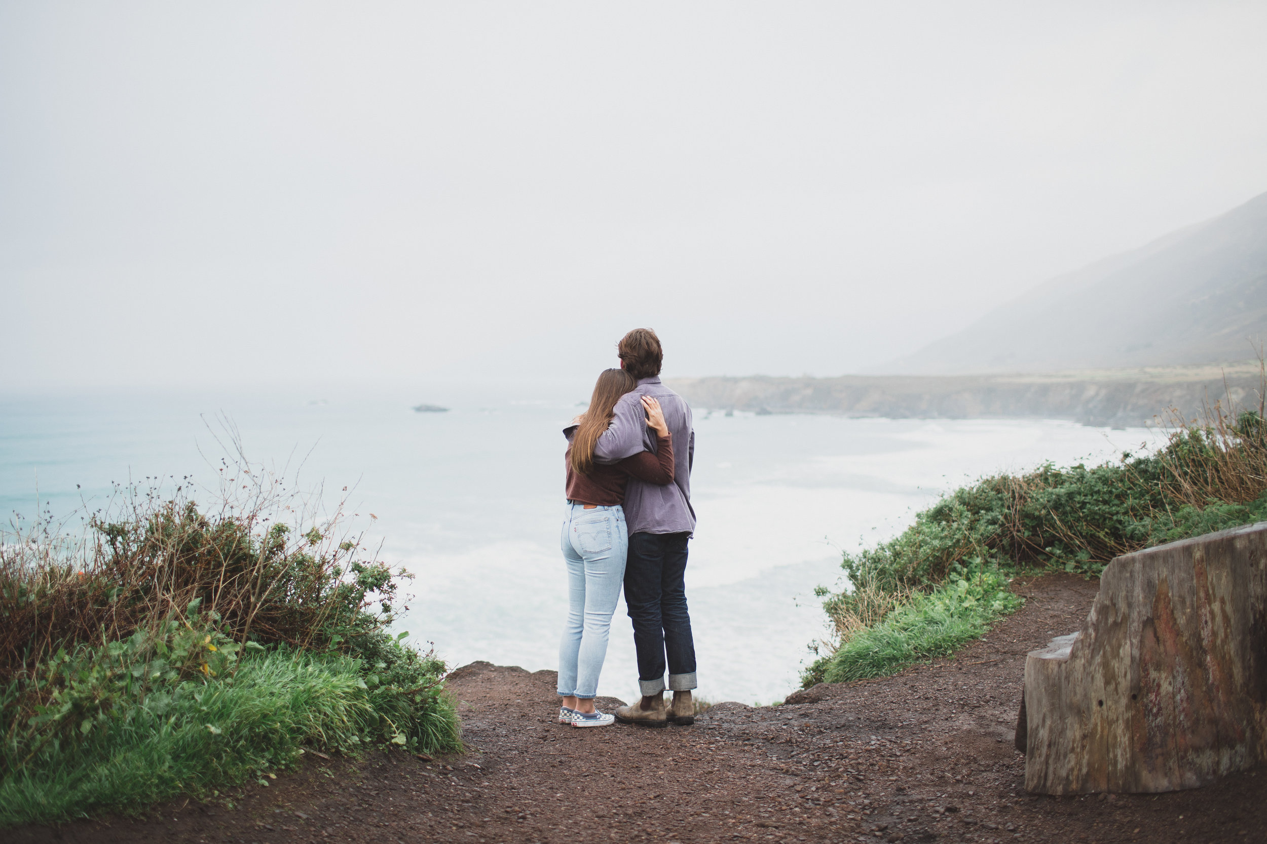 couple standing on big sur cliffs
