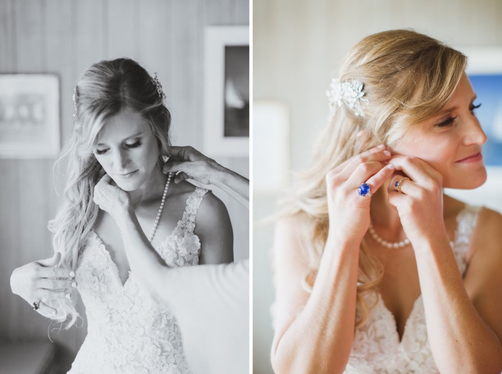 bride putting on necklace and earrings