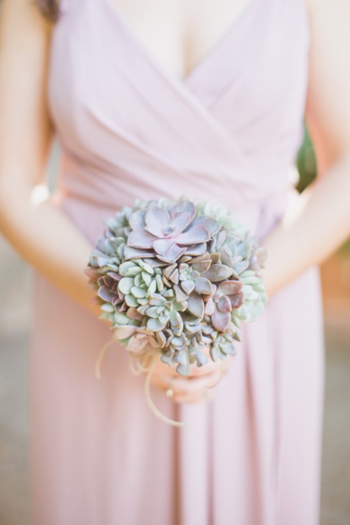 bridesmaid holding succulent boquet